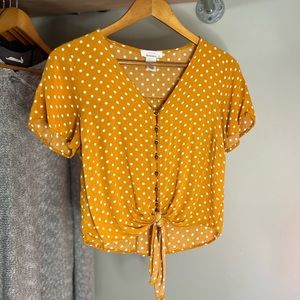 Semi crop, tie front, yellow and white polka dot top